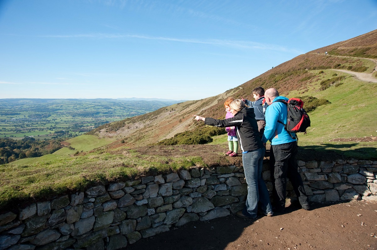Family looking out from a hillside