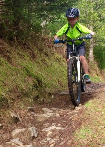 Boy riding on trail