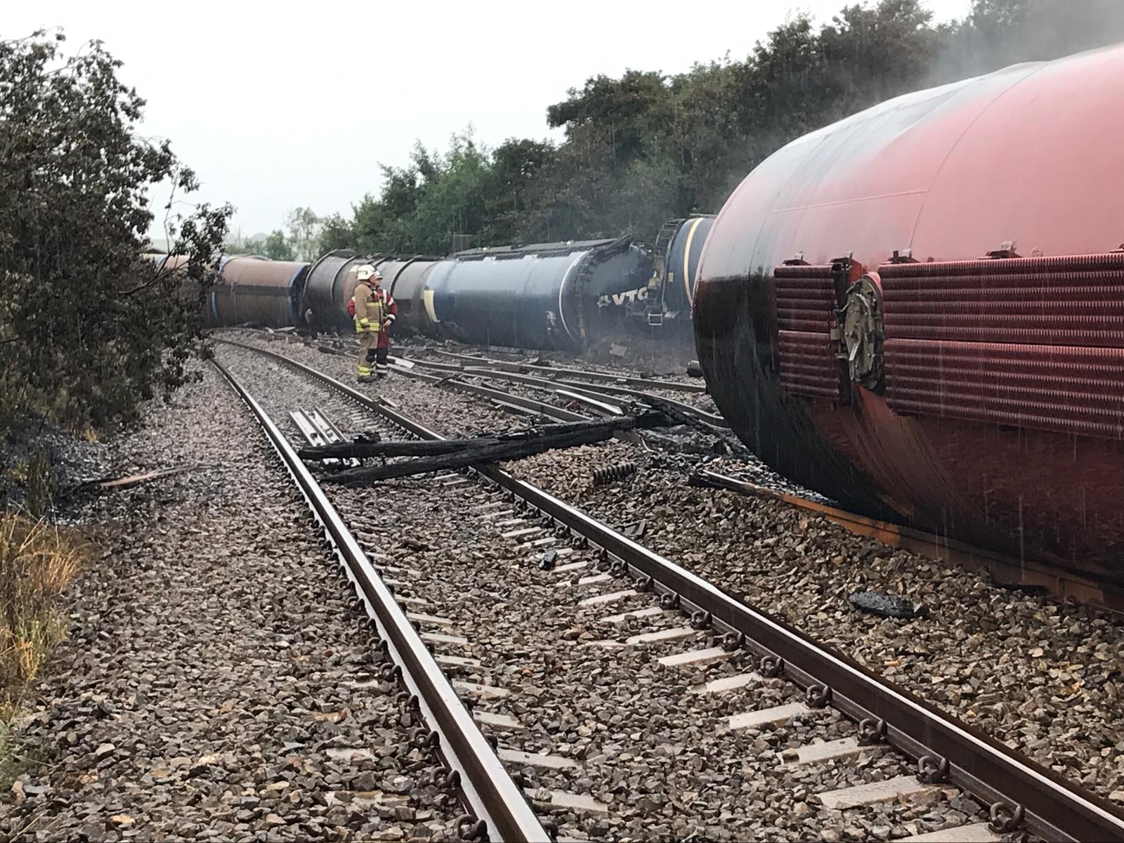 Photo of train wagons derailed