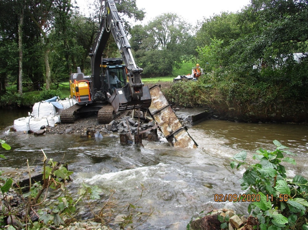 A crane lifts out the weir at Vicar's Mill on the Eastern Cleddau. 