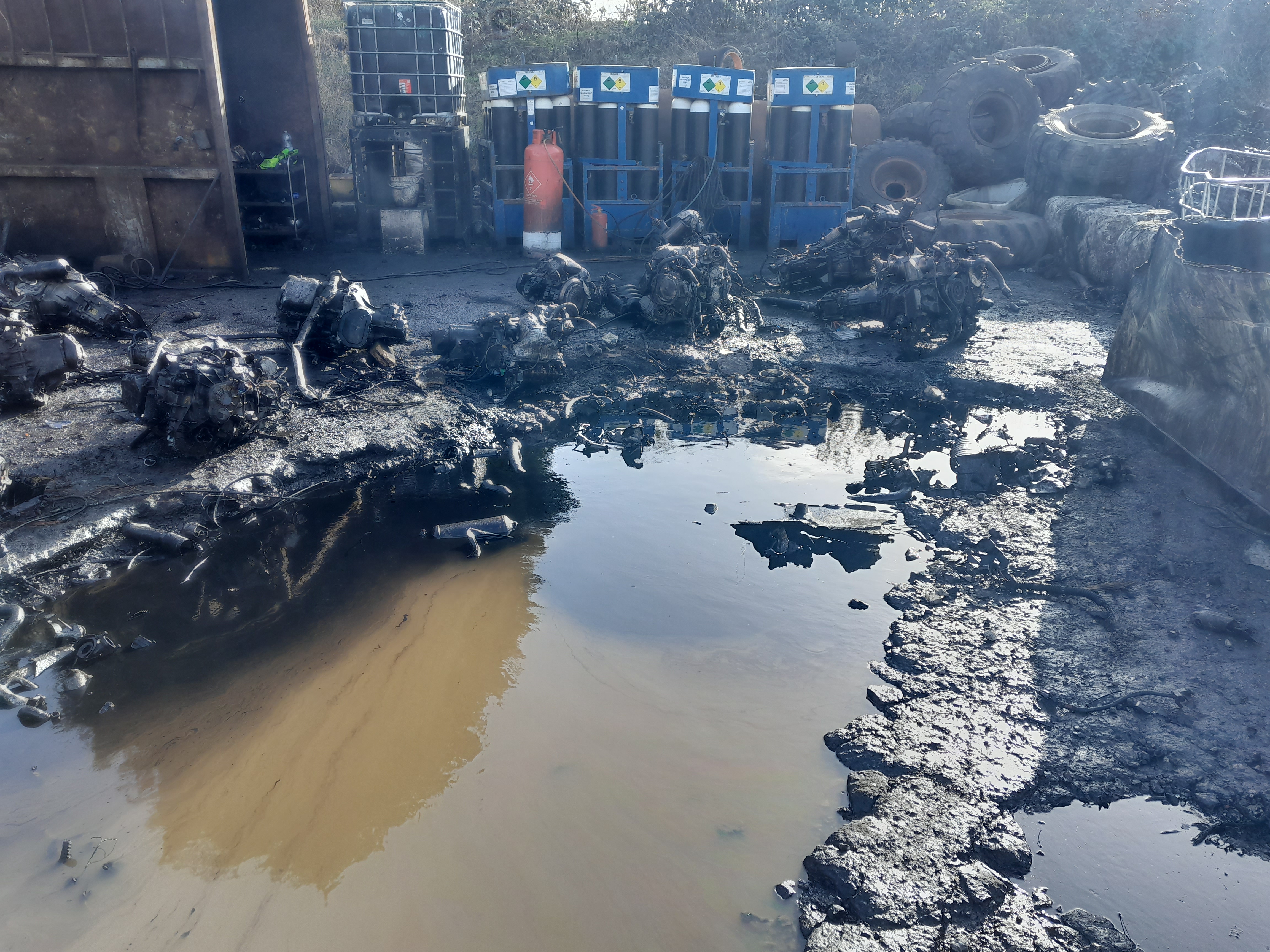 Oil contamination and poor state of the impermeable pad at Ammanford Recycling Ltd.